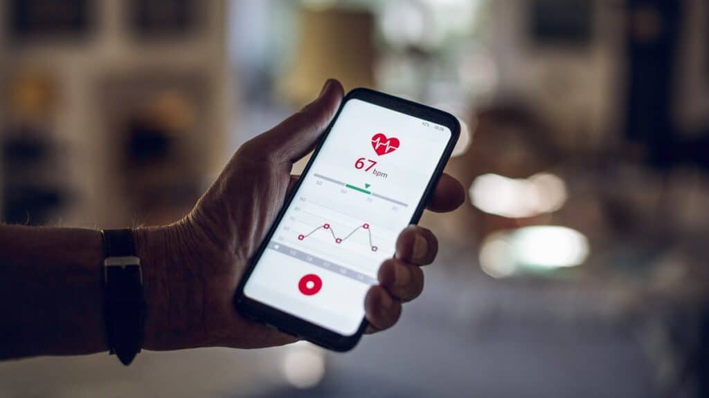 Mobile app ideas for healthcare.
Senior holding smartphone, using fitness app
